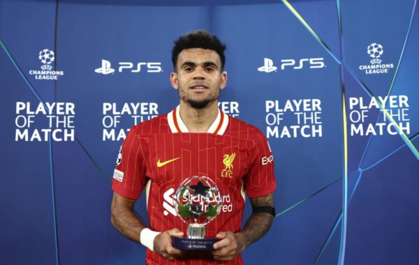 LIVERPOOL, ENGLAND - NOVEMBER 05: Luis Diaz of Liverpool poses for a photo after being awarded the PlayStation Player of the Match at full-time following the team's victory in the UEFA Champions League 2024/25 League Phase MD4 match between Liverpool FC and Bayer 04 Leverkusen at Anfield on November 05, 2024 in Liverpool, England. (Photo by Naomi Baker - UEFA/UEFA via Getty Images)