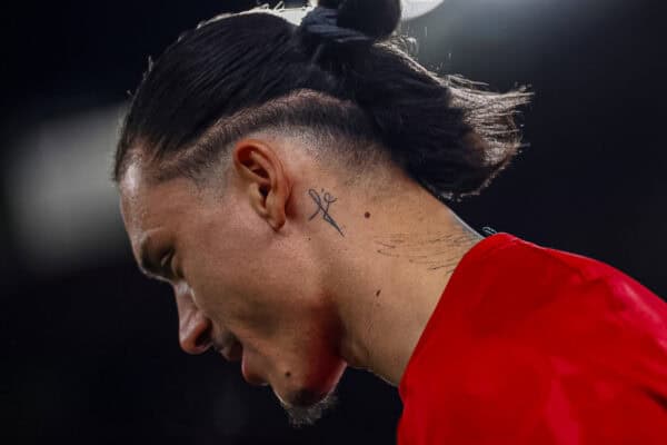 LIVERPOOL, ENGLAND - MARCH 11: A tattoo is visible on the neck of Darwin Nunez of Liverpool FC as he looks on during the warm up prior to the UEFA Champions League 2024/25 UEFA Champions League 2024/25 Round of 16 Second Leg match between Liverpool FC and Paris Saint-Germain at Anfield on March 11, 2025 in Liverpool, England. (Photo by UEFA)