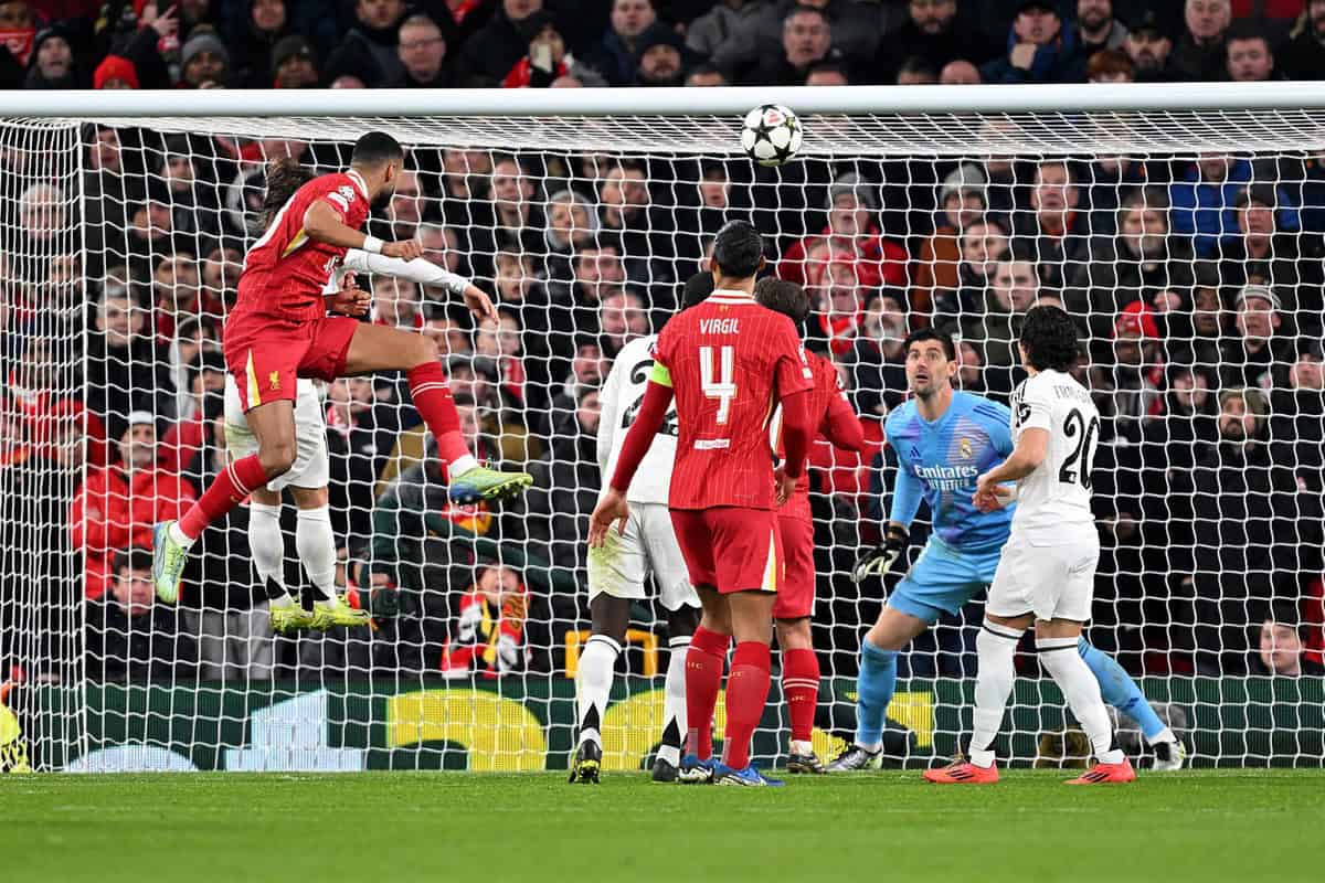 LIVERPOOL, ENGLAND - NOVEMBER 27: Cody Gakpo of Liverpool scores his team's second goal past Thibaut Courtois of Real Madrid during the UEFA Champions League 2024/25 League Phase MD5 match between Liverpool FC and Real Madrid C.F. at Anfield on November 27, 2024 in Liverpool, England. (Photo by Michael Regan - UEFA/UEFA via Getty Images)