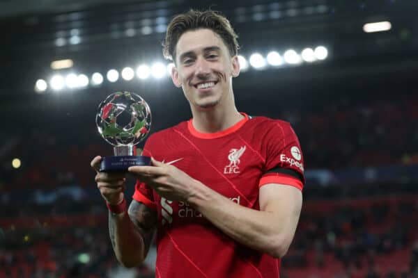 LIVERPOOL, ENGLAND - APRIL 13: Kostas Tsimikas of Liverpool poses for a picture with the UEFA Playstation Player of the Match after the UEFA Champions League Quarter Final Leg Two match between Liverpool FC and SL Benfica at Anfield on April 13, 2022 in Liverpool, England. (Photo by Jan Kruger - UEFA/UEFA via Getty Images)