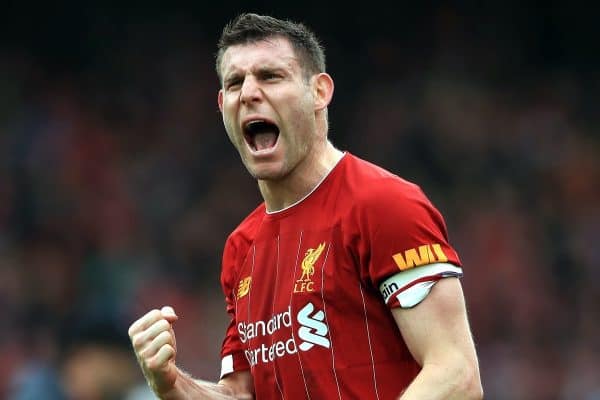 Liverpool's James Milner celebrates their victory after the final whistle at the Premier League match at Anfield, Liverpool.