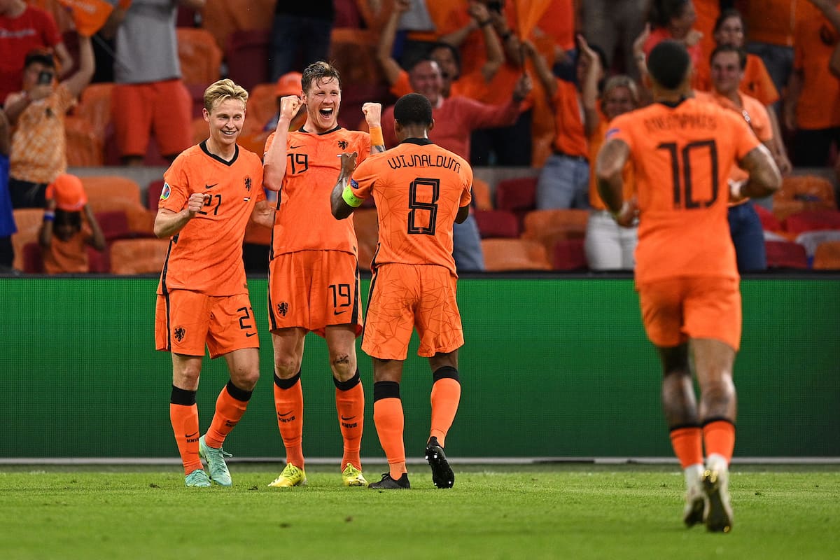 AMSTERDAM, NETHERLANDS - JUNE 13: Wout Weghorst of Netherlands celebrates with Frenkie de Jong and Georginio Wijnaldum after scoring their side's second goal during the UEFA Euro 2020 Championship Group C match between Netherlands and Ukraine at the Johan Cruijff ArenA on June 13, 2021 in Amsterdam, Netherlands. (Photo by Lukas Schulze - UEFA/UEFA via Getty Images)