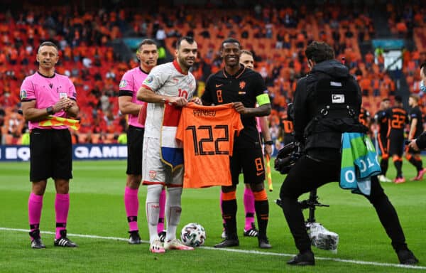 AMSTERDAM, NETHERLANDS - JUNE 21: Goran Pandev of North Macedonia receives a shirt from Georginio Wijnaldum of Netherlands prior to the UEFA Euro 2020 Championship Group C match between North Macedonia and The Netherlands at Johan Cruijff Arena on June 21, 2021 in Amsterdam, Netherlands. (Photo by Lukas Schulze - UEFA/UEFA via Getty Images)