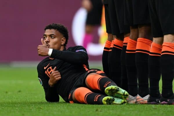 AMSTERDAM, NETHERLANDS - JUNE 21: Donyell Malen of Netherlands reacts as he lies behind the Netherlands wall as they defend a free kick during the UEFA Euro 2020 Championship Group C match between North Macedonia and The Netherlands at Johan Cruijff Arena on June 21, 2021 in Amsterdam, Netherlands. (Photo by Lukas Schulze - UEFA)