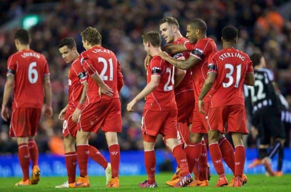 LIVERPOOL, ENGLAND - Monday, April 13, 2015: Liverpool's Joe Allen is mobbed by team-mates as he celebrates scores the second goal against Newcastle United during the Premier League match at Anfield. (Pic by David Rawcliffe/Propaganda)