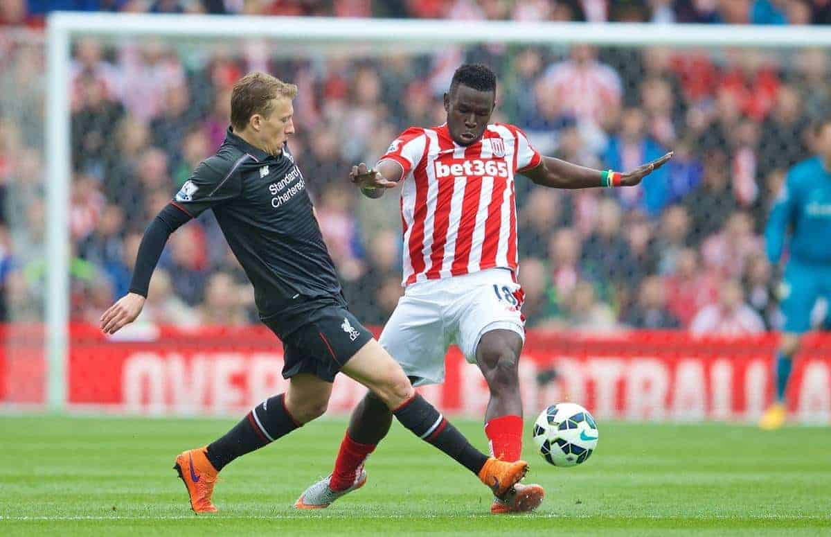STOKE-ON-TRENT, ENGLAND - Sunday, May 24, 2015: Liverpool's Lucas Leiva in action against Stoke City's Mame Diram Dioufc during the Premier League match at the Britannia Stadium. (Pic by David Rawcliffe/Propaganda)