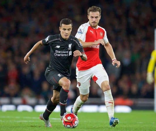 LONDON, ENGLAND - Monday, August 24, 2015: Liverpool's Philippe Coutinho Correia in action against Arsenal's Aaron Ramsey during the Premier League match at the Emirates Stadium. (Pic by David Rawcliffe/Propaganda)