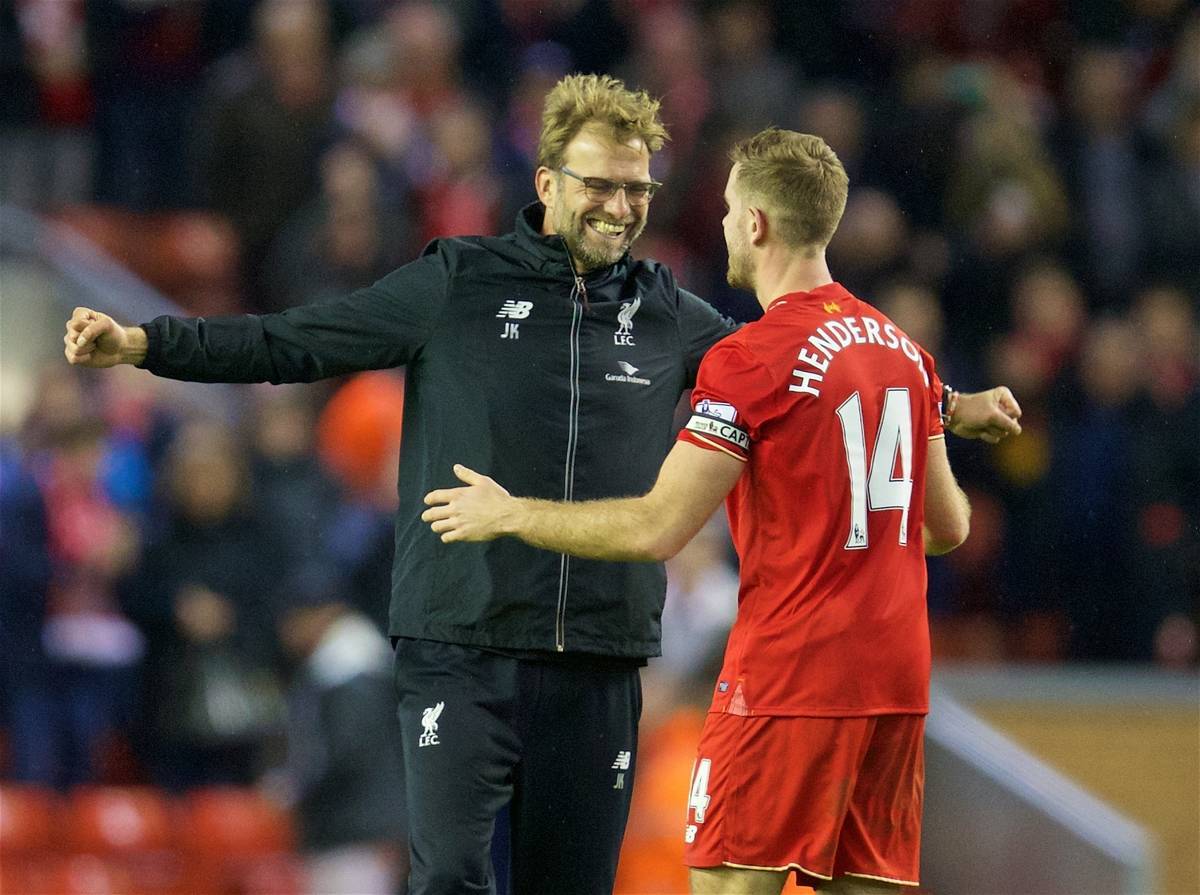 LIVERPOOL, ENGLAND - Boxing Day, Saturday, December 26, 2015: Liverpool's manager Jürgen Klopp celebrates the 1-0 victory over Leicester City with captain Jordan Henderson during the Premier League match at Anfield. (Pic by David Rawcliffe/Propaganda)