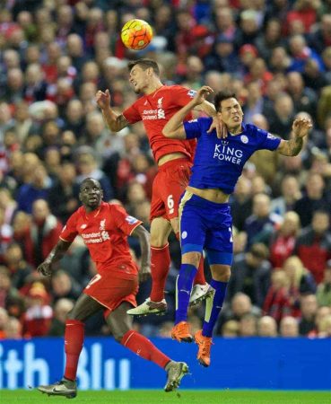 LIVERPOOL, ENGLAND - Boxing Day, Saturday, December 26, 2015: Liverpool's Dejan Lovren in action against Leicester City's Leonardo Ulloa during the Premier League match at Anfield. (Pic by David Rawcliffe/Propaganda)