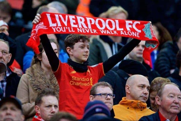LIVERPOOL, ENGLAND - Saturday, January 7, 2017: A young Liverpool supporter holds up a scarf before the FA Cup 3rd Round match against Plymouth Argyle at Anfield. (Pic by David Rawcliffe/Propaganda)