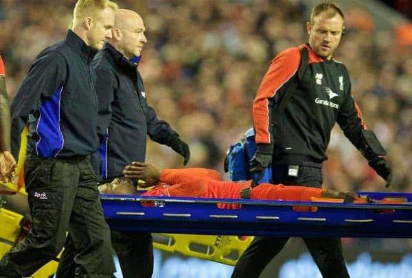 LIVERPOOL, ENGLAND - Wednesday, April 20, 2016: Liverpool's Divock Origi is carried off injured during the Premier League match against Everton at Anfield, the 226th Merseyside Derby. (Pic by David Rawcliffe/Propaganda)