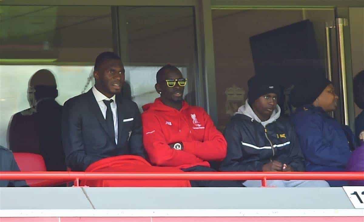 LIVERPOOL, ENGLAND - Saturday, April 23, 2016: Liverpool's Mamadou Sakho [in sunglasses] and Christian Benteke watch their side draw 2-2 with Newcastle United during the Premier League match at Anfield. (Pic by Bradley Ormesher/Propaganda)