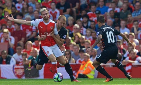 LONDON, ENGLAND - Sunday, August 14, 2016: Liverpool's Philippe Coutinho Correia and Ragnar Klavan in action against Arsenal's Aaron Ramsey during the FA Premier League match at the Emirates Stadium. (Pic by David Rawcliffe/Propaganda)