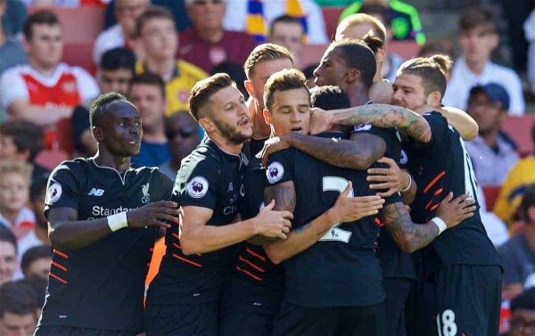 LONDON, ENGLAND - Sunday, August 14, 2016: Liverpool's Philippe Coutinho Correia celebrates scoring the third goal against Arsenal with team-mates during the FA Premier League match at the Emirates Stadium. (Pic by David Rawcliffe/Propaganda)