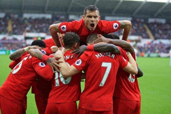 LIVERPOOL, ENGLAND - Saturday, October 1, 2016: Liverpool's Dejan Lovren jumps on the huddle as James Milner celebrates scoring the second goal against Swansea City from the penalty spot to make the score 2-1 during the FA Premier League match at the Liberty Stadium. (Pic by David Rawcliffe/Propaganda)