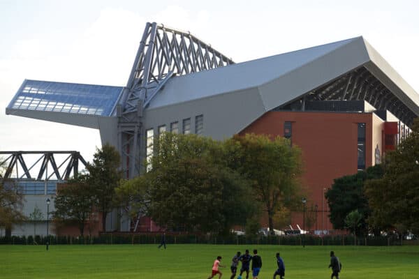 LIVERPOOL, ENGLAND - Saturday, October 22, 2016: Children play football in Stanley Park in the shadow of Liverpool new Main Stand pictured before the FA Premier League match against West Bromwich Albion at Anfield. (Pic by David Rawcliffe/Propaganda)