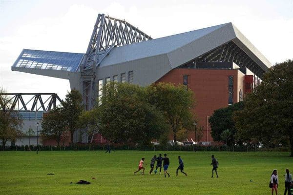 LIVERPOOL, ENGLAND - Saturday, October 22, 2016: Children play football in Stanley Park in the shadow of Liverpool new Main Stand pictured before the FA Premier League match against West Bromwich Albion at Anfield. (Pic by David Rawcliffe/Propaganda)