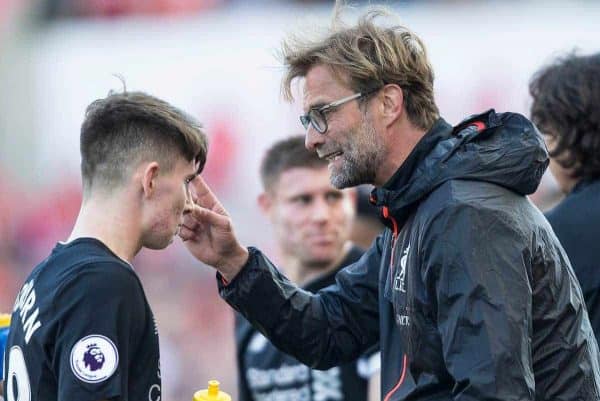 STOKE-ON-TRENT, ENGLAND - Saturday, April 8, 2017: Liverpool's manager Jurgen Klopp speaks with Ben Woodburn during the FA Premier League match against Stoke City at the Bet365 Stadium. (Pic by Laura Malkin/Propaganda)