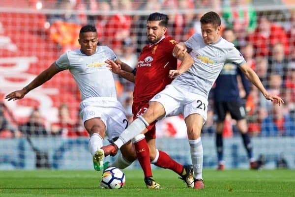 LIVERPOOL, ENGLAND - Saturday, October 14, 2017: Liverpool's Emre Can is tackled by Manchester United's Antonio Valencia and Ander Herrera during the FA Premier League match between Liverpool and Manchester United at Anfield. (Pic by David Rawcliffe/Propaganda)