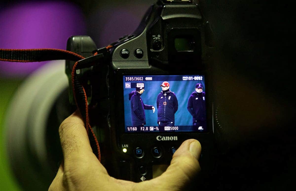 LIVERPOOL, ENGLAND - Tuesday, December 5, 2017: A photographer reviews his picture of Liverpool manager Jürgen Klopp on the back of his camera during a training session at Melwood Training Ground ahead of the UEFA Champions League Group E match between Liverpool FC and FC Spartak Moscow. (Pic by David Rawcliffe/Propaganda)