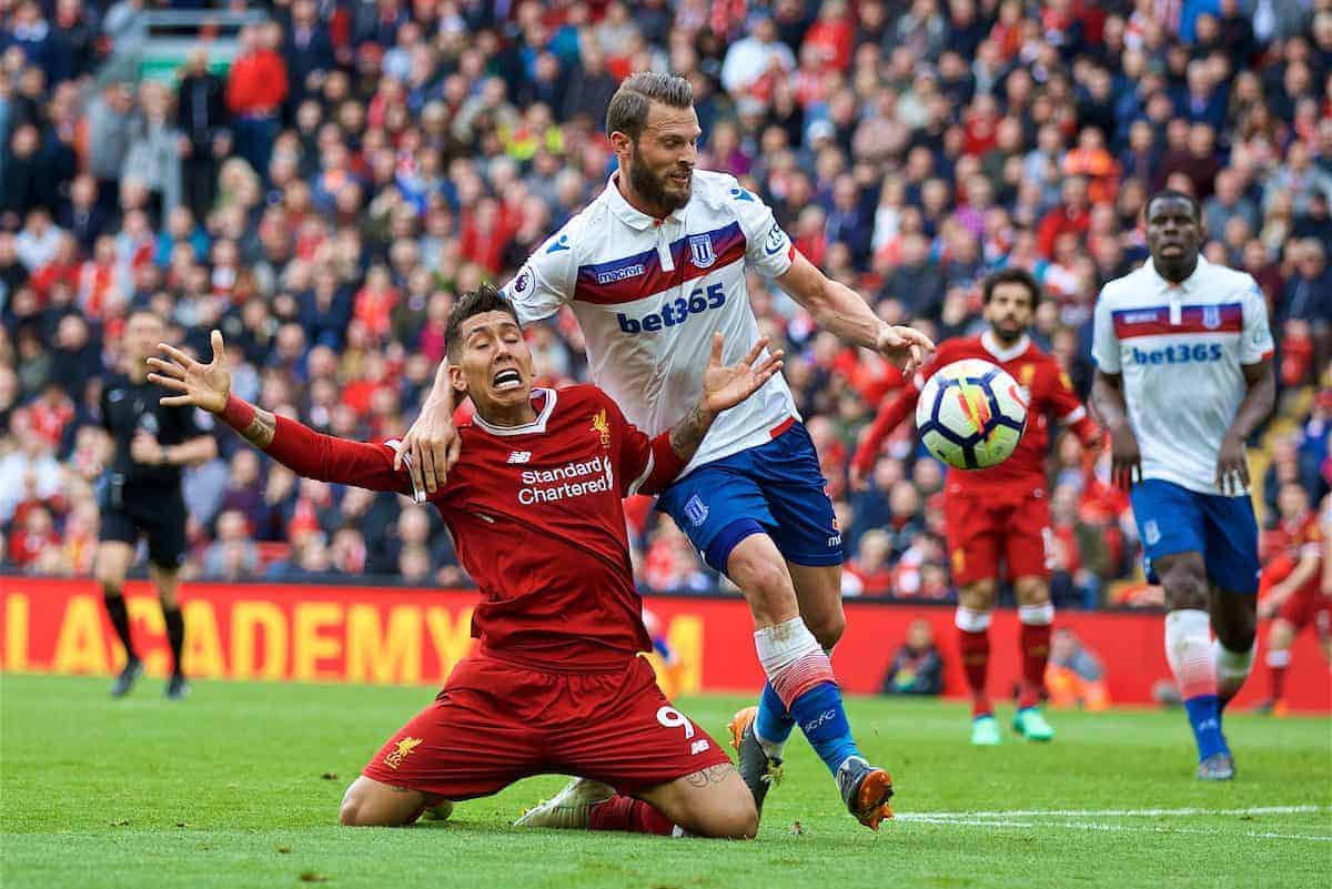 LIVERPOOL, ENGLAND - Saturday, April 28, 2018: Liverpool's Roberto Firmino is brought down by Stoke City's Erik Pieters but no penalty is awarded during the FA Premier League match between Liverpool FC and Stoke City FC at Anfield. (Pic by David Rawcliffe/Propaganda)