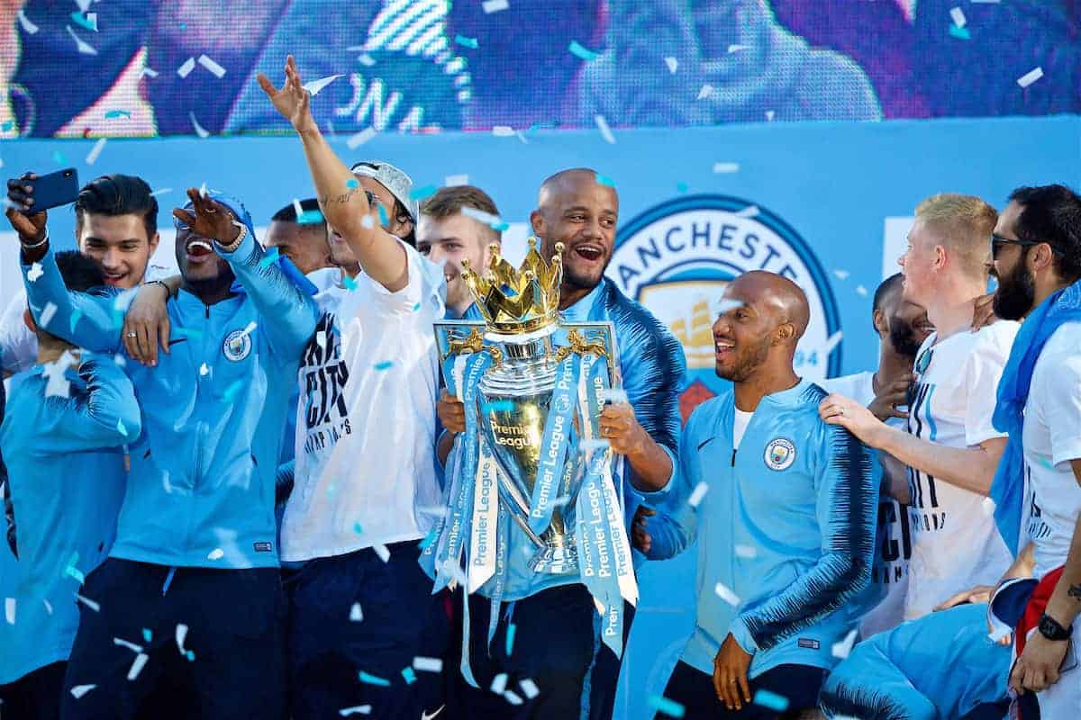 MANCHESTER, ENGLAND - Monday, May 14, 2018: Manchester City's captain Vincent Kompany celebrates with the trophy on stage after the parade through the city after winning the FA Premier League and the Football League Cup trophies. (Pic by David Rawcliffe/Propaganda)