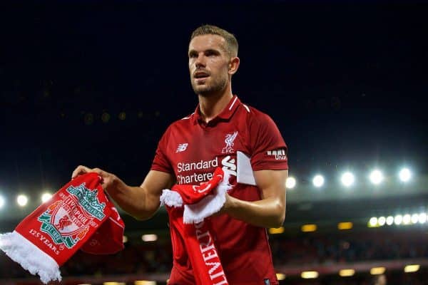 LIVERPOOL, ENGLAND - Tuesday, August 7, 2018: Liverpool's captain Jordan Henderson hands out balls and scarves top supporters after the preseason friendly match between Liverpool FC and Torino FC at Anfield. (Pic by David Rawcliffe/Propaganda)