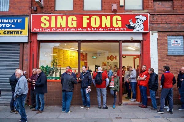 LIVERPOOL, ENGLAND - Tuesday, September 18, 2018: Supporters frequent Sing Fong, a famous Chinese chip shop outside Anfield, before the UEFA Champions League Group C match between Liverpool FC and Paris Saint-Germain. (Pic by David Rawcliffe/Propaganda)