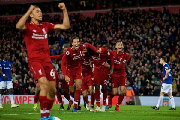 LIVERPOOL, ENGLAND - Sunday, December 2, 2018: Liverpool's Divock Origi (2nd from R) celebrates with team-mates Virgil van Dijk (L) and Fabio Henrique Tavares 'Fabinho' (R) after his winning goal deep into injury time during the FA Premier League match between Liverpool FC and Everton FC at Anfield, the 232nd Merseyside Derby. Liverpool won 1-0. (Pic by Paul Greenwood/Propaganda)