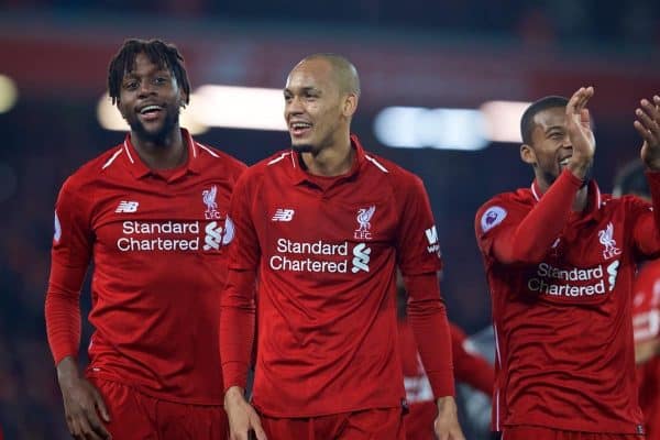 LIVERPOOL, ENGLAND - Sunday, December 2, 2018: Liverpool's match winning goal-scorer Divock Origi (L) celebrates with Fabio Henrique Tavares 'Fabinho' and Georginio Wijnaldum after a dramatic late injury time goal during the FA Premier League match between Liverpool FC and Everton FC at Anfield, the 232nd Merseyside Derby. Liverpool won 1-0. (Pic by Paul Greenwood/Propaganda)