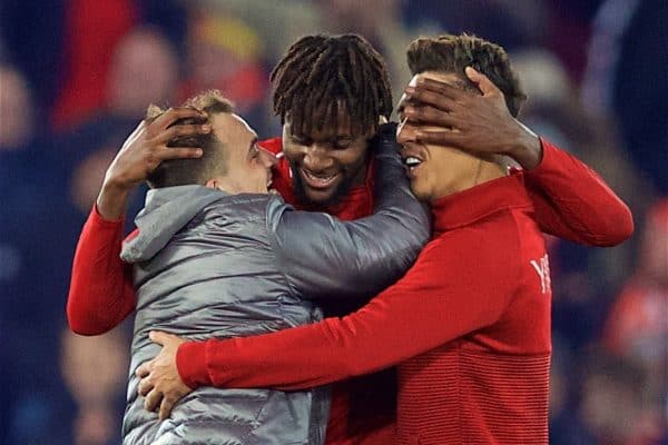 LIVERPOOL, ENGLAND - Sunday, December 2, 2018: Liverpool's match winning goal-scorer Divock Origi (C) celebrates with Xherdan Shaqiri (L) and Roberto Firmino (R) after a dramatic late injury time goal during the FA Premier League match between Liverpool FC and Everton FC at Anfield, the 232nd Merseyside Derby. Liverpool won 1-0. (Pic by Paul Greenwood/Propaganda)