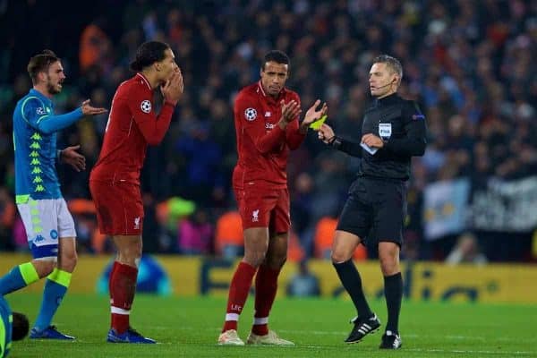 LIVERPOOL, ENGLAND - Tuesday, December 11, 2018: Liverpool's Virgil van Dijk (L) is shown a yellow card by referee Damir Skomina during the UEFA Champions League Group C match between Liverpool FC and SSC Napoli at Anfield. (Pic by David Rawcliffe/Propaganda)