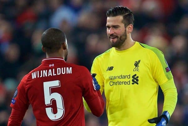 LIVERPOOL, ENGLAND - Tuesday, December 11, 2018: Liverpool's goalkeeper Alisson Becker celebrates with Georginio Wijnaldum after beating SSC Napoli 1-0 and progressing to the knock-out phase during the UEFA Champions League Group C match between Liverpool FC and SSC Napoli at Anfield. (Pic by David Rawcliffe/Propaganda)