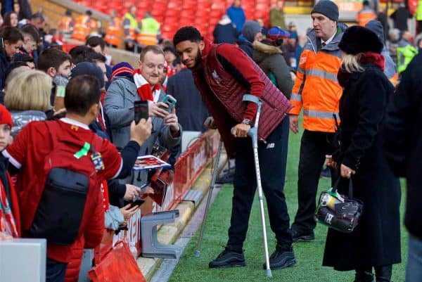 LIVERPOOL, ENGLAND - Boxing Day, Wednesday, December 26, 2018: Liverpool's injured Joe Gomez on crutches stops for photographs with supporters before the FA Premier League match between Liverpool FC and Newcastle United FC at Anfield. (Pic by David Rawcliffe/Propaganda)