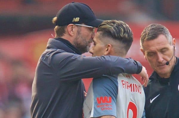 MANCHESTER, ENGLAND - Sunday, February 24, 2019: Liverpool's Roberto Firmino embraces manager J¸rgen Klopp after being injured during the FA Premier League match between Manchester United FC and Liverpool FC at Old Trafford. (Pic by David Rawcliffe/Propaganda)