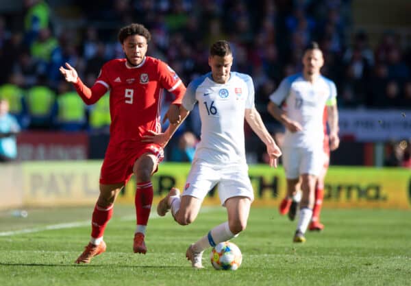 CARDIFF, WALES - Sunday, March 24, 2019: Wales' Tyler Roberts (L) challenges for the ball against Slovakia's Dávid Hancko (R) during the opening UEFA Euro 2020 Qualifying Group E match between Wales and Slovakia at the Cardiff City Stadium. (Pic by Gareth Davies/Propaganda)