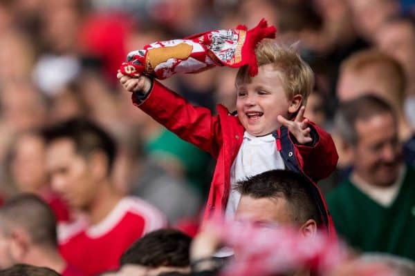 BLACKBURN, ENGLAND - Thursday, July 19, 2018: A young Liverpool supporter waves his scarf as he celebrates the second goal during a preseason friendly match between Blackburn Rovers FC and Liverpool FC at Ewood Park. (Pic by Paul Greenwood/Propaganda)