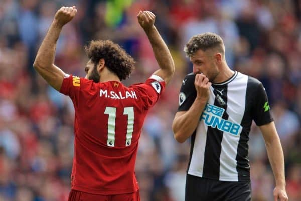 LIVERPOOL, ENGLAND - Saturday, September 14, 2019: Liverpool's Mohamed Salah (L) celebrates scoring the third goal as Newcastle United's Paul Dummett looks dejected during the FA Premier League match between Liverpool FC and Newcastle United FC at Anfield. (Pic by David Rawcliffe/Propaganda)