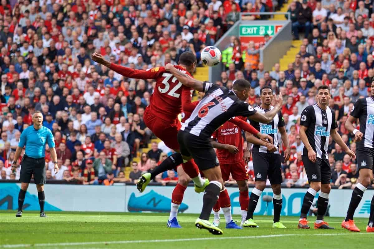 LIVERPOOL, ENGLAND - Saturday, September 14, 2019: Liverpool's Joel Matip is pulled back by Newcastle United's captain Jamaal Lascelles put no penalty is awarded during the FA Premier League match between Liverpool FC and Newcastle United FC at Anfield. (Pic by David Rawcliffe/Propaganda)