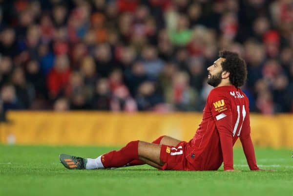 LIVERPOOL, ENGLAND - Sunday, October 27, 2019: Liverpool's Mohamed Salah goes down injured during the FA Premier League match between Liverpool FC and Tottenham Hotspur FC at Anfield. (Pic by David Rawcliffe/Propaganda)