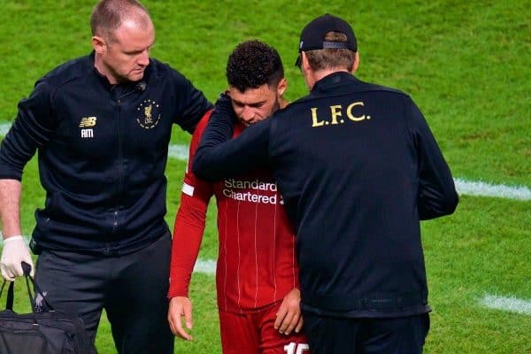 DOHA, QATAR - Saturday, December 21, 2019: Liverpool's Alex Oxlade-Chamberlain is treated during the FIFA Club World Cup Qatar 2019 Final match between CR Flamengo and Liverpool FC at the Khalifa Stadium. (Pic by Peter Powell/Propaganda)