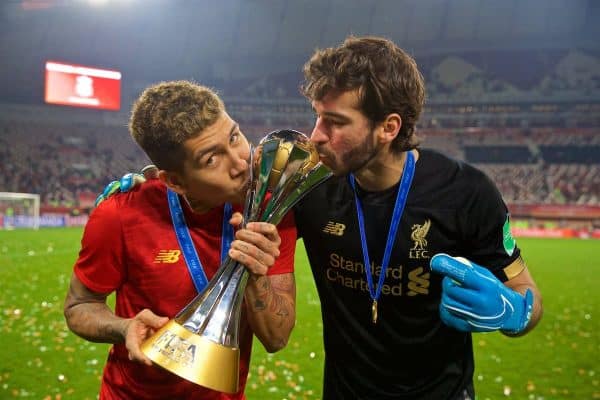 DOHA, QATAR - Saturday, December 21, 2019: Liverpool's Roberto Firmino and goalkeeper Alisson Becker kiss the trophy after the FIFA Club World Cup Qatar 2019 Final match between CR Flamengo and Liverpool FC at the Khalifa Stadium. Liverpool won 1-0 after extra time. (Pic by David Rawcliffe/Propaganda)