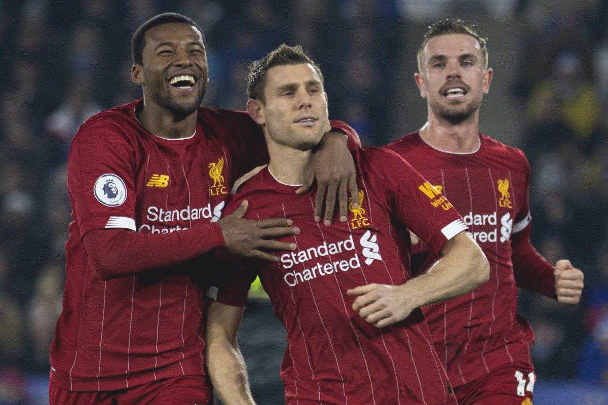 LEICESTER, ENGLAND - Thursday, December 26, 2019: Liverpool's James Milner (C) scores the second goal, from a penalty kick, with team-mate Georginio Wijnaldum (L) and captain Jordan Henderson (R) during the FA Premier League match between Leicester City FC and Liverpool FC at the King Power Stadium. (Pic by David Rawcliffe/Propaganda)