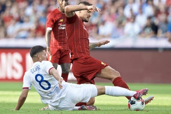 GENEVA, SWITZERLAND - Wednesday, July 31, 2019: Liverpool's Dejan Lovren tackles Olympique Lyonnais' Houssem Aouar during a pre-season friendly match between Liverpool FC and Olympique Lyonnais at Stade de Genève. (Pic by David Rawcliffe/Propaganda)