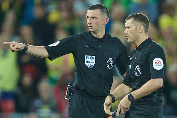 LIVERPOOL, ENGLAND - Friday, August 9, 2019: referee Michael Oliver sends his assistant off the field for a replacement battery delaying the start of the second half during the opening FA Premier League match of the season between Liverpool FC and Norwich City FC at Anfield. (Pic by David Rawcliffe/Propaganda)