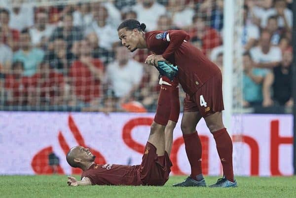 ISTANBUL, TURKEY - Wednesday, August 14, 2019: Liverpool's Fabio Henrique Tavares 'Fabinho' is treated for cramp by team-mate Virgil van Dijk at the final whistle during the UEFA Super Cup match between Liverpool FC and Chelsea FC at Besiktas Park. (Pic by David Rawcliffe/Propaganda)