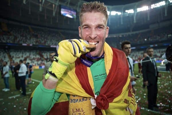 ISTANBUL, TURKEY - Wednesday, August 14, 2019: Liverpool's goalkeeper Adrián San Miguel del Castillo bites his winners' medal as he celebrates after saving the decisive fifth penalty from Chelsea in the shoot-out to win the Super Cup during the UEFA Super Cup match between Liverpool FC and Chelsea FC at Besiktas Park. Liverpool won 5-4 on penalties after a 1-1 draw. (Pic by David Rawcliffe/Propaganda)