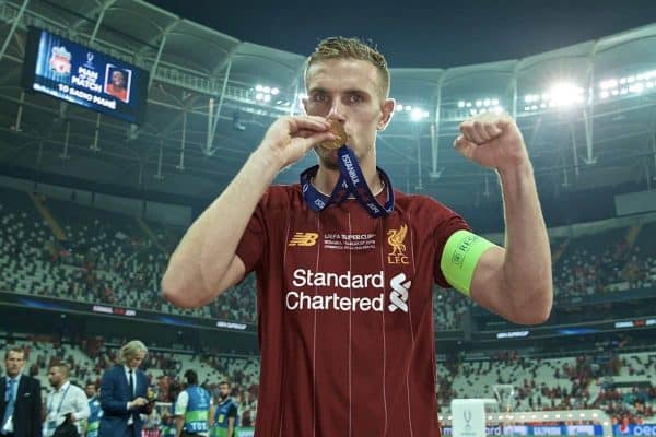 ISTANBUL, TURKEY - Wednesday, August 14, 2019: Liverpool's captain Jordan Henderson bites his winners' medal as he celebrates after beating Chelsea in the shoot-out to win the Super Cup during the UEFA Super Cup match between Liverpool FC and Chelsea FC at Besiktas Park. Liverpool won 5-4 on penalties after a 1-1 draw. (Pic by David Rawcliffe/Propaganda)