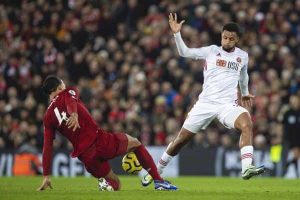 LIVERPOOL, ENGLAND - Thursday, January 2, 2020: Liverpool's Virgil van Dijk (L) tackles Sheffield United's David McGoldrick during the FA Premier League match between Liverpool FC and Sheffield United FC at Anfield. (Pic by David Rawcliffe/Propaganda)