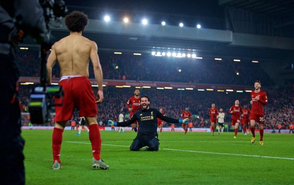 LIVERPOOL, ENGLAND - Sunday, January 19, 2020: Liverpool's Mohamed Salah celebrates scoring the second goal with team-mate goalkeeper Alisson Becker during the FA Premier League match between Liverpool FC and Manchester United FC at Anfield. (Pic by David Rawcliffe/Propaganda)